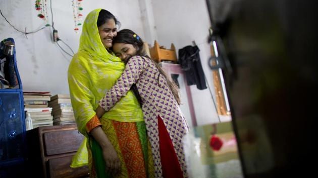 Sharmin Akhter hugs her mother Moyna Begum, who five years ago worked at Rana Plaza. The disaster focused international attention on Bangladesh’s role as the world’s second-largest garment producer, and led the government and manufacturing associations to promise big improvements. As a result many of the world’s top clothing brands said they would stop contracting with factories if they failed to improve safety for their workers. (A.M. Ahad / AP)