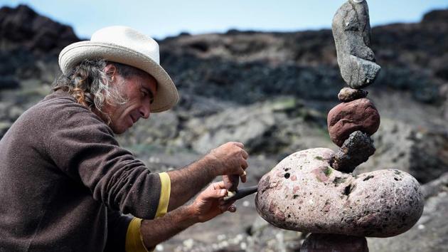 Marco Montesini from Spain competes in the European Stone Stacking Championships 2018 in Dunbar, Scotland. Sculpture artists gathered in Scotland on Sunday to compete for the weighty title of champion stone stacker, in a quirky competition launched last year. (Andy Buchanan / AFP)