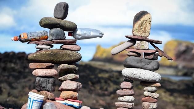 James Brunt of England said that he got into stone stacking seeing somebody in the south of England on a beach about seven years ago. Where other spectators saw a kind of magic, Brunt said he saw the science behind it. “I started using different materials, leaves, sticks -- whatever nature throws at me I’ll use to make artwork with.” (Andy Buchanan / AFP)