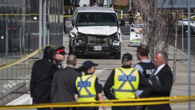 A driver deliberately plowed his white Ryder rental van into a lunch-hour crowd in Toronto on Monday, killing 10 people and injuring 15 along a roughly 1.6-km long stretch of sidewalk thronged with pedestrians, police said. (Aaron Vincent Elkaim / The Canadian Press via AP) A driver deliberately plowed his white Ryder rental van into a lunch-hour crowd in Toronto on Monday, killing 10 people and injuring 15 along a roughly 1.6-km long stretch of sidewalk thronged with pedestrians, police said. (Aaron Vincent Elkaim / The Canadian Press via AP)