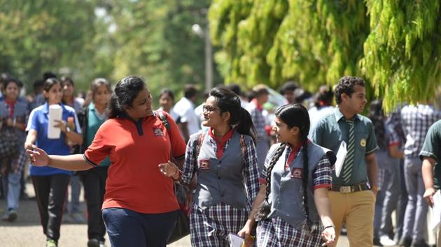 Students coming out of Jawaharlal Nehru school after appearing in CBSE Class12 economics exam in Bhopal on March 26, 2018. The exam was cancelled by the CBSE due to question paper leak.(Mujeeb Faruqui/HT Photo)