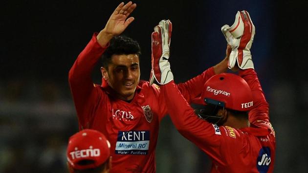 Kings XI Punjab (KXIP) bowler Mujeeb Ur Rahman (centre) celebrates with teammates after taking the wicket of Delhi Daredevils batsman Rishabh Pant during their 2018 Indian Premier League (IPL 2018) match at the Feroz Shah Kotla cricket stadium in New Delhi on Monday.(AFP)