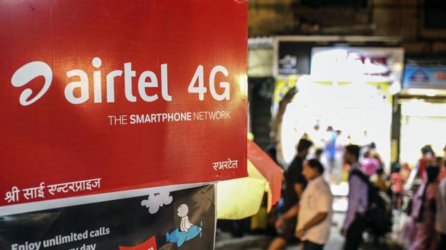 Pedestrians walk past an advertisment for Bharti Airtel Ltd. in Mumbai, India. (Dhiraj Singh/Bloomberg) Pedestrians walk past an advertisment for Bharti Airtel Ltd. in Mumbai, India. (Dhiraj Singh/Bloomberg)