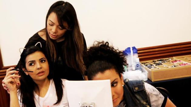 Ana Paula de Camargo (L) and Camila (R), who are visually impaired, apply makeup overseen by their teacher. No need for mirrors here as these women go about applying eye-liner, mascara and blush brushes. (Nacho Doce / REUTERS) Ana Paula de Camargo (L) and Camila (R), who are visually impaired, apply makeup overseen by their teacher. No need for mirrors here as these women go about applying eye-liner, mascara and blush brushes. (Nacho Doce / REUTERS)