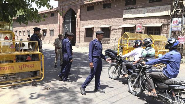 Security officers keep guard outside Central Jail, where Asaram Bapu is being lodged in Jodhpur on Tuesday.(AP Photo)