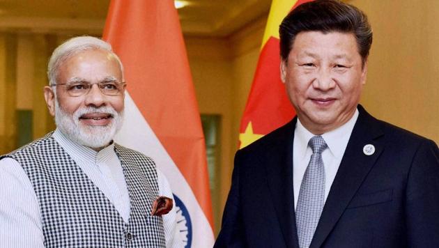 Prime Minister Narendra Modi with Chinese President Xi Jinping during a meeting in Tashkent on the sidelines of a summit.(PTI FILE)