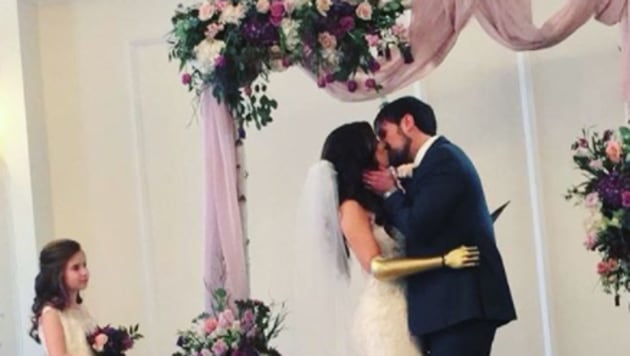 Rebekah Marine wore a golden bionic arm on her wedding. (Rebekah Marine/Instagram)