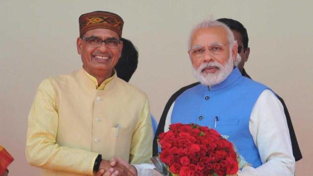The tiles will have Prime Minister Narendra Modi’s photo on the left side of a logo and Madhya Pradesh chief minister Shivraj Singh Chouhan’s on the right. (HT File Photo) The tiles will have Prime Minister Narendra Modi’s photo on the left side of a logo and Madhya Pradesh chief minister Shivraj Singh Chouhan’s on the right. (HT File Photo)