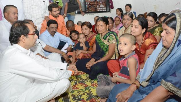 Shiv Sena chief Uddhav Thackeray (extreme left) on Wednesday met families of the two Shiv Sena leaders who were shot dead earlier this month in Ahmednagar district.(HT PHOTO)