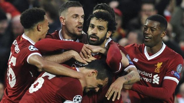 Mohamed Salah (C) was the star for Liverpool as they thrashed AS Roma in the UEFA Champions League. He is currently ahead of Cristiano Ronaldo and Lionel Messi in the goalscorers list.(AP)