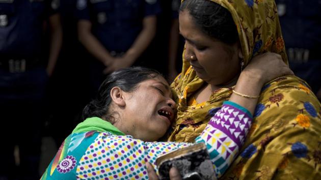 A relative of a victim of the Rana Plaza garment factory collapse cries during a protest. Hundreds of Bangladeshi citizens staged protests and paid tearful tributes at Rana Plaza on Tuesday in Dhaka, marking the fifth anniversary of one of the world’s worst industrial disasters, when a textile factory complex collapse killed at least 1,130 people and left thousands injured. (A.M. Ahad / AP)