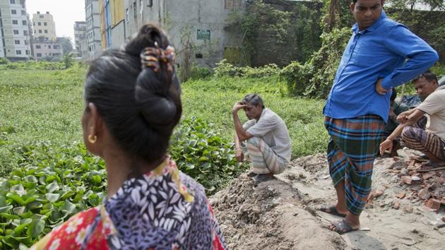 Relatives of victims gather at the site of Rana Plaza recalling the tragedy. Jolly Talukder, union leader said the injured workers have become the living dead. Talukder demanded the release of some $14.5 million which she said was donated to a government fund for victims. But the Bangladesh Garment Manufacturers and Exporters Association said the victims and their families have already been compensated. (A.M. Ahad / AP)