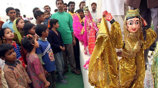 The nearly 13-acre Kathputli Colony was the first of Delhi’s slums taken up for in-situ redevelopment, as part of the regularization of illegal colonies, on a public-private partnership plan by the Delhi Government. Seen here is a puppetry performance on the foundation laying ceremony of the event on February 15, 2009 at Shadipur. (Arvind Yadav / HT Archive)