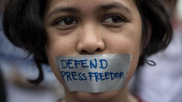 A college student participates in a protest to defend press freedom in Manila. A Reporters Without Borders survey says Norway topped the list of having the world’s freest press for the second year in a row.(AFP Photo)
