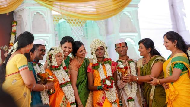 A wedding ceremony was held for visually challenged couples in the city. The ceremony included all the rituals from haldi to sangeet. The wedding was organised by Sewa Mitra Mandal and Louis Braille visually challenged organisation at Fadgate in Pune on Sunday, April 22.  (Rahul Raut/HT PHOTO) 