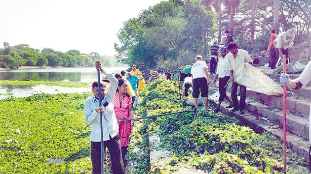 The Rotary Club of Walhekarwadi, a non profit organisation has cleared 1257 tonnes of hyacinth from last 171 days without any help of civic body with an aim to clear Pavana river in Pune, India, on Tuesday, April 24, 2018. (HT PHOTO)(HT PHOTO)