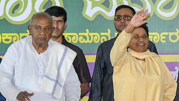 BSP chief Mayawati flanked by former Prime Minister HD Deve Gowda (L) and JD(S) state president HD Kumaraswamy (R) waves at her supporters during a campaign for Karnataka assembly elections in Mysore on Wednesday. (PTI) BSP chief Mayawati flanked by former Prime Minister HD Deve Gowda (L) and JD(S) state president HD Kumaraswamy (R) waves at her supporters during a campaign for Karnataka assembly elections in Mysore on Wednesday. (PTI)