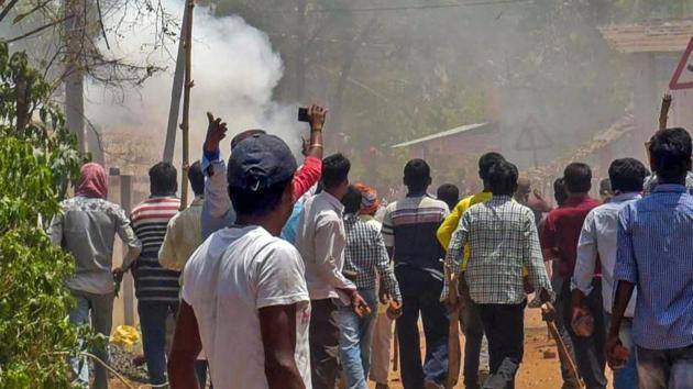 Trinamool Congress and BJP activists clash at Karidhya village in Birbhum district of West Bengal on April 23. (PTI Photo) Trinamool Congress and BJP activists clash at Karidhya village in Birbhum district of West Bengal on April 23. (PTI Photo)
