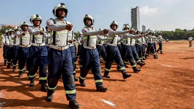 Fire fighter personnel march along. The governor of Maharashtra addresses the public at the event every year.  (Kunal Patil/HT Photo) 
