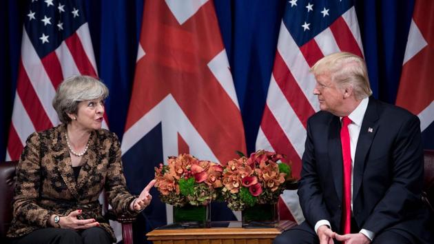 British Prime Minister Theresa May addresses the press as US President Donald Trump listens during a meeting at the Palace Hotel in New York on September 20, 2017.(AFP File Photo)