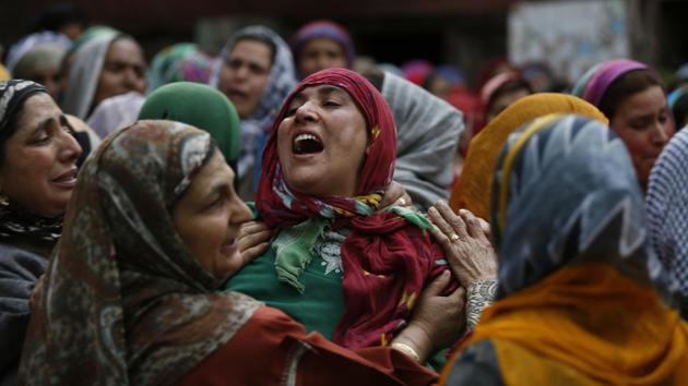 An unidentified relative of slain political worker Ghulam Nabi Patel breaks down during his funeral at Dangarpura, Jammu and Kashmir on April 25, 2018. (Mukhtar Khan / AP) An unidentified relative of slain political worker Ghulam Nabi Patel breaks down during his funeral at Dangarpura, Jammu and Kashmir on April 25, 2018. (Mukhtar Khan / AP)