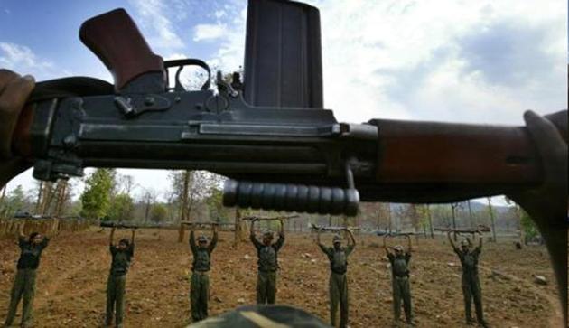 Maoist rebels raise their arms during an exercise at a temporary base in the Abujh Marh forests, in Chhattisgarh.(AP File Photo/Representative image) Maoist rebels raise their arms during an exercise at a temporary base in the Abujh Marh forests, in Chhattisgarh.(AP File Photo/Representative image)