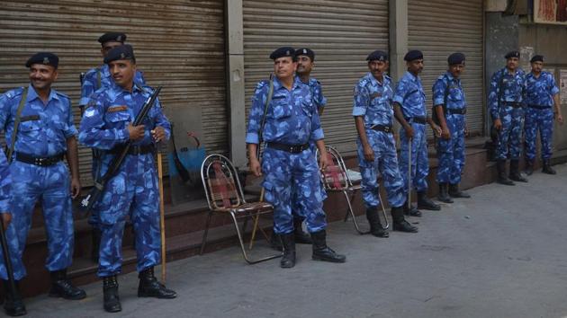 Security forces in a in bazaar amid a bandh call by caste organisations in Phagwara on Wednesday.(HT Photo)