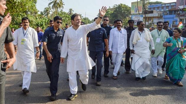 Congress president Rahul Gandhi waves at his party supporters during a campaign ahead of Karnataka assembly elections in Honnavar on April 26.(PTI Photo)