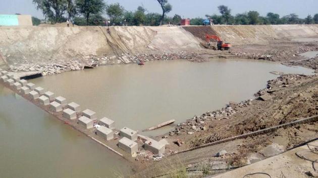 Repair works going on at Indira Gandhi Feeder canal.(HT File)