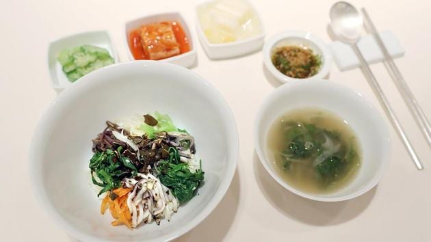 Bibimbap, a dish traditional to both North and South Korea, featuring various vegetables mixed with rice, and banchan sides, will be served at the upcoming inter-Korean summit. Symbolism will be the main course of the banquet at Friday’s summit, Seoul revealed Tuesday, with a menu featuring Pyongyang’s signature dish and food from the home towns of the South’s leaders at previous meetings. (The Blue House / AFP)