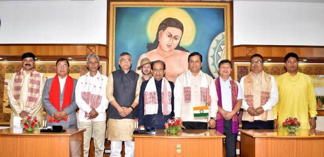 Assam governor Jagdish Mukhi (centre) and chief minister Sarbananda Sonowal (4th from right) pose for a photograph with new ministers after the swearing-in ceremony, at Raj Bhawan in Guwahati on Thursday. (PTI) Assam governor Jagdish Mukhi (centre) and chief minister Sarbananda Sonowal (4th from right) pose for a photograph with new ministers after the swearing-in ceremony, at Raj Bhawan in Guwahati on Thursday. (PTI)