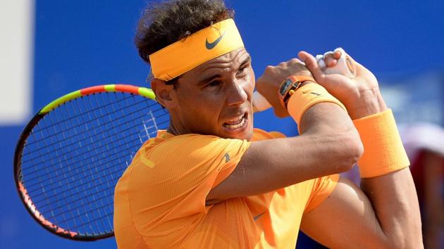 Spain's Rafael Nadal returns the ball to Guillermo Garcia Lopez during their Barcelona Open match on Thursday.(AFP)