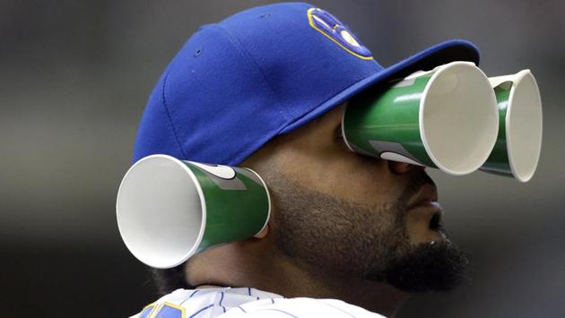 Milwaukee Brewers’ Jonathan Villar watches from the dugout with cups on his face during the fifth inning of a baseball game against the Miami Marlins, in Milwaukee, Wisconsin. (Aaron Gash / AP) Milwaukee Brewers’ Jonathan Villar watches from the dugout with cups on his face during the fifth inning of a baseball game against the Miami Marlins, in Milwaukee, Wisconsin. (Aaron Gash / AP)