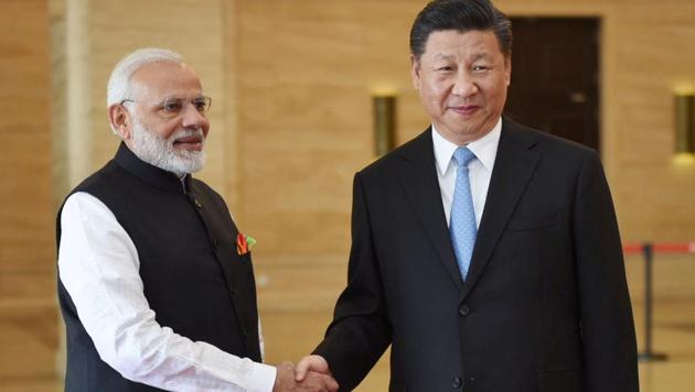 Chinese President Xi Jinping and Prime Minister Narendra Modi will have a series of one-on-one conversations focusing on bilateral, global and regional issues during the informal summit in Wuhan. (REUTERS) Chinese President Xi Jinping and Prime Minister Narendra Modi will have a series of one-on-one conversations focusing on bilateral, global and regional issues during the informal summit in Wuhan. (REUTERS)