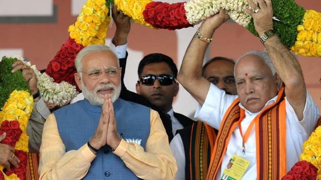 Prime Minister Narendra Modi and party’s CM candidate BS Yeddyurappa during a rally in Bengaluru.(AFP File Photo)