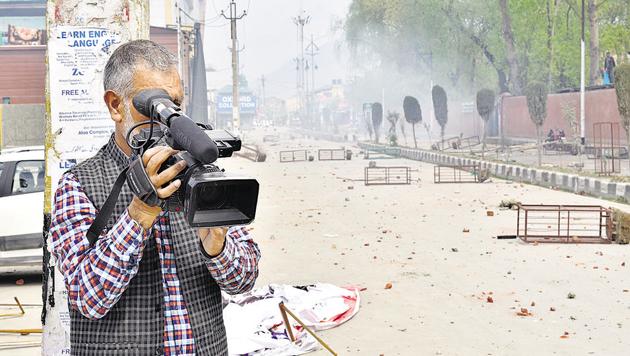 Meraj-ud-din of AP is a veteran cameraman of Kashmir.(Ajay Aggarwal/HT PHOTO)