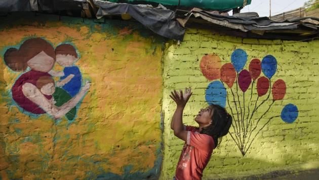 Light Up, a social venture that focuses on equipping children, parents and teachers with emotional intelligence, celebrated its first year by sprucing up the slums of Chanakyapuri’s Sanjay Camp in New Delhi with colours and social messages. Around 90 artists, college students from institutions like Jamia Millia Islamia, NIFT- Delhi, Hindu college, Sanskriti School, and the Light Up Team participated in this two day event. (Burhaan Kinu / HT Photo) Light Up, a social venture that focuses on equipping children, parents and teachers with emotional intelligence, celebrated its first year by sprucing up the slums of Chanakyapuri’s Sanjay Camp in New Delhi with colours and social messages. Around 90 artists, college students from institutions like Jamia Millia Islamia, NIFT- Delhi, Hindu college, Sanskriti School, and the Light Up Team participated in this two day event. (Burhaan Kinu / HT Photo)