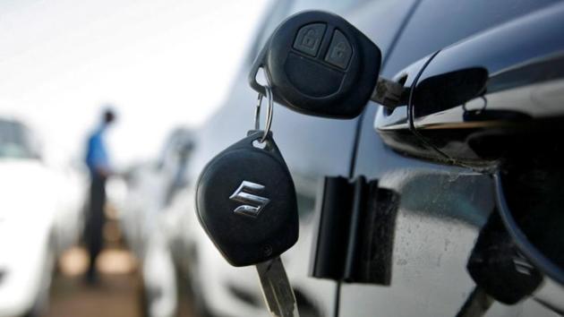 Keys hang from the door of a Maruti Suzuki Swift car at its stockyard on the outskirts of Ahmedabad.(Reuters File Phot.)