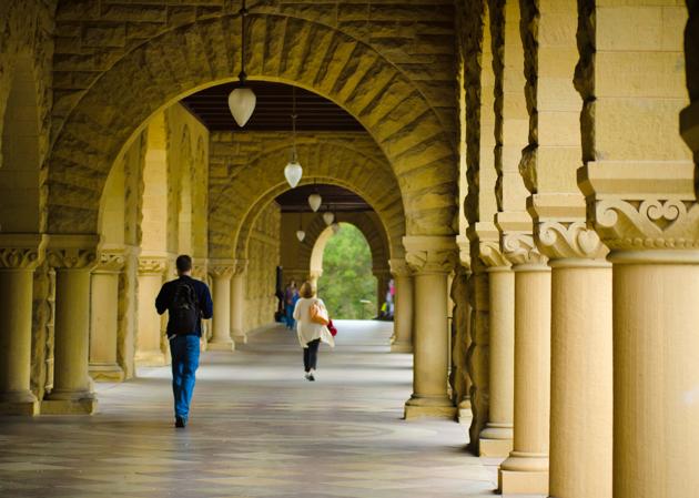 Students walk underneath a covered walkway at the Stanford University campus on their way to classes. Eminent institutions such as Harvard and Stanford reserve a place of pride for their liberal arts programmes.(Getty Images)