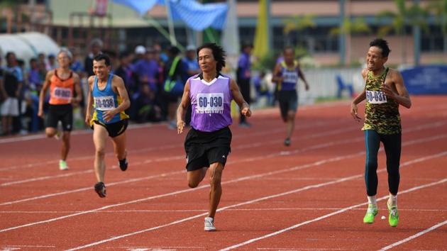 Men in the 60-65 age category run the 400m sprint.Thailand’s population is getting older, and fast, posing risks to the middle-income country’s social and medical services as well as its economic productivity. (Lillian Suwanrumpha / AFP) Men in the 60-65 age category run the 400m sprint.Thailand’s population is getting older, and fast, posing risks to the middle-income country’s social and medical services as well as its economic productivity. (Lillian Suwanrumpha / AFP)