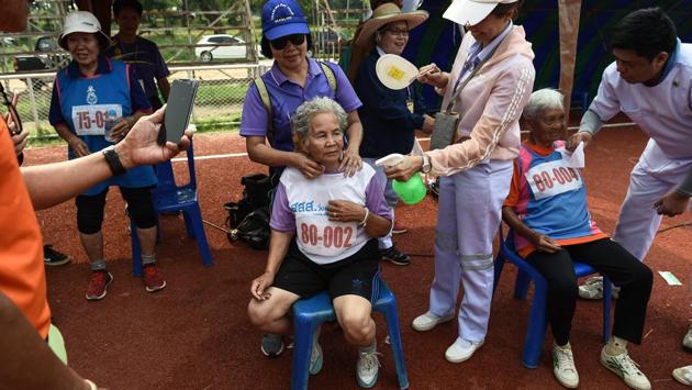 Duangpee Sansing (C), the 81-year-old winner of a 400-metre race, rests after completing the race. “It doesn’t matter if I get a medal or not, I feel happy to see friends competing together,” Sansing said. (Lillian Suwanrumpha / AFP) Duangpee Sansing (C), the 81-year-old winner of a 400-metre race, rests after completing the race. “It doesn’t matter if I get a medal or not, I feel happy to see friends competing together,” Sansing said. (Lillian Suwanrumpha / AFP)