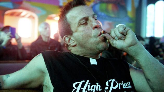 Rockin Ray of Brooklyn, New York, a member of the International Church of Cannabis, smokes a joint during the church's 4/20 celebration in Denver, Colorado. The non-denominational, multi-faith church celebrated it's one year anniversary. Members refer to themselves as Elevationists and practise Elevationism which incorporates the use of cannabis as a sacrament to 'elevate' one's self. (Jason Connolly / AFP) Rockin Ray of Brooklyn, New York, a member of the International Church of Cannabis, smokes a joint during the church's 4/20 celebration in Denver, Colorado. The non-denominational, multi-faith church celebrated it's one year anniversary. Members refer to themselves as Elevationists and practise Elevationism which incorporates the use of cannabis as a sacrament to 'elevate' one's self. (Jason Connolly / AFP)