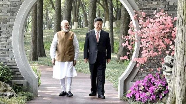 Prime Minister Narendra Modi and Chinese president Xi Jinping take a walk by the East Lake in Wuhan, China on Saturday.(MEA/Twitter)