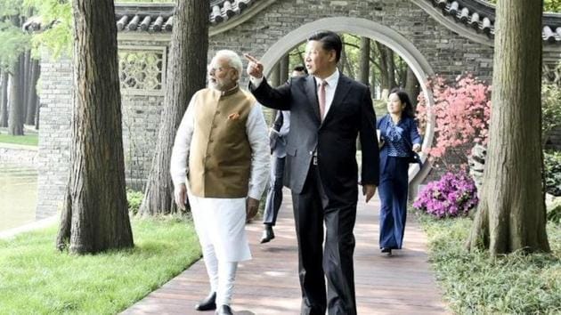 Prime Minister Narendra Modi and president Xi Jinping walk along the East Lake in Wuhan on Saturday morning. Posting this image on Twitter, Modi said, “President Xi Jinping and I continued our deliberations this morning. Here are some pictures from the walk along Wuhan’s East Lake. We discussed multiple aspects of bilateral ties between our nations.”(Narendra Modi/Twitter)