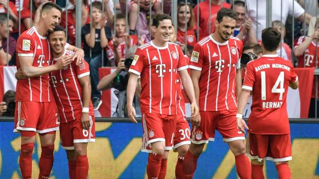 Bayern Munich's Sandro Wagner (L) celebrates after scoring during their Bundesliga match against Eintracht Frankfurt in Munich.(AFP)