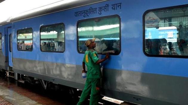 A railway worker cleans a coach prior to the trial run at New Delhi railway station. (AFP File Photo) A railway worker cleans a coach prior to the trial run at New Delhi railway station. (AFP File Photo)