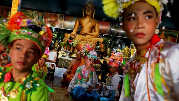 “When I saw my friends doing this, I decided to become a novice. I want to be the Buddha’s representative. I want to be a good person,” August said. (Jorge Silva / REUTERS) 