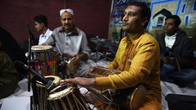 Performances traditionally last hours, with a troupe of musicians interweaving soulful improvisation under lyrical, lilting vocal lines to a steady beat of rhythms on dholak, tabla and hand clapping, sending fans drifting into trance-like transcendent states. (Asif Hassan / AFP) 