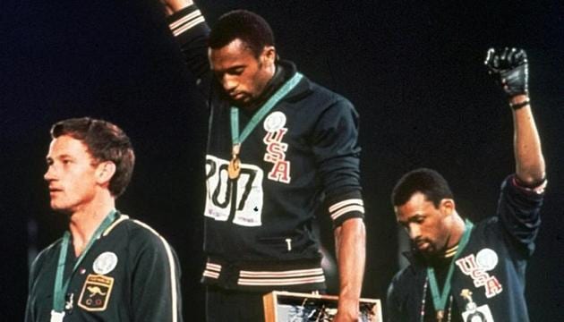 In this Oct. 16, 1968, file photo, Australian silver medallist Peter Norman, left, stands on the podium as Americans Tommie Smith, centre, and John Carlos raise their gloved fists in a human rights protest -- the Black Power Salute during the 1968 Mexico Olympics.(AP)