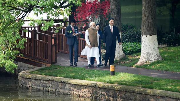 Prime Minister Narendra Modi with Chinese President Xi Jinping take a walk together along the East Lake, in Wuhan, China on April 27.(PTI Photo)